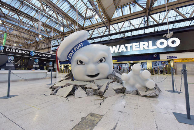 LONDON, ENGLAND - JULY 11:  Stay Puft Marshmallow Man is seen on the concourse at Waterloo Station on July 11, 2016 in London, England. Ghostbusters take over Waterloo Station as Stay Puft Marshmallow Man smashes through the concourse during the morning rush-hour. Standing at 2.9m in height with a circumference of 8.5m commuters come face-to-face with the mammoth menace. Ghostbusters is in cinemas from today.  (Photo by Gareth Cattermole/Getty Images for Sony Pictures)